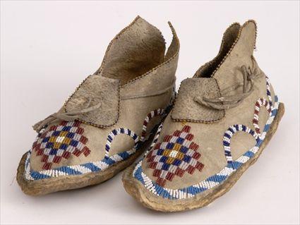 Appraisal: PAIR OF SOUTHWESTERN APACHE MOCCASINS in See Pleasing The Spirits