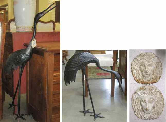 Appraisal: TWO PAIR OF CAST IRON GARDEN SCULPTURES two standing cranes