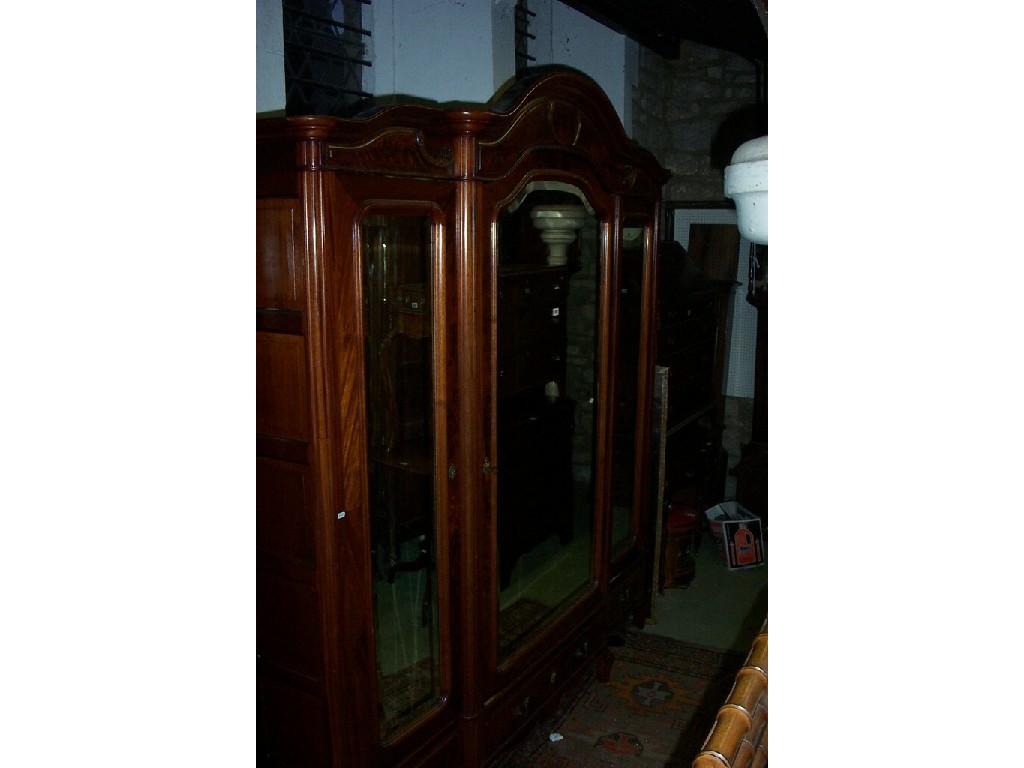 Appraisal: A good quality th century mahogany breakfront wardrobe enclosed by