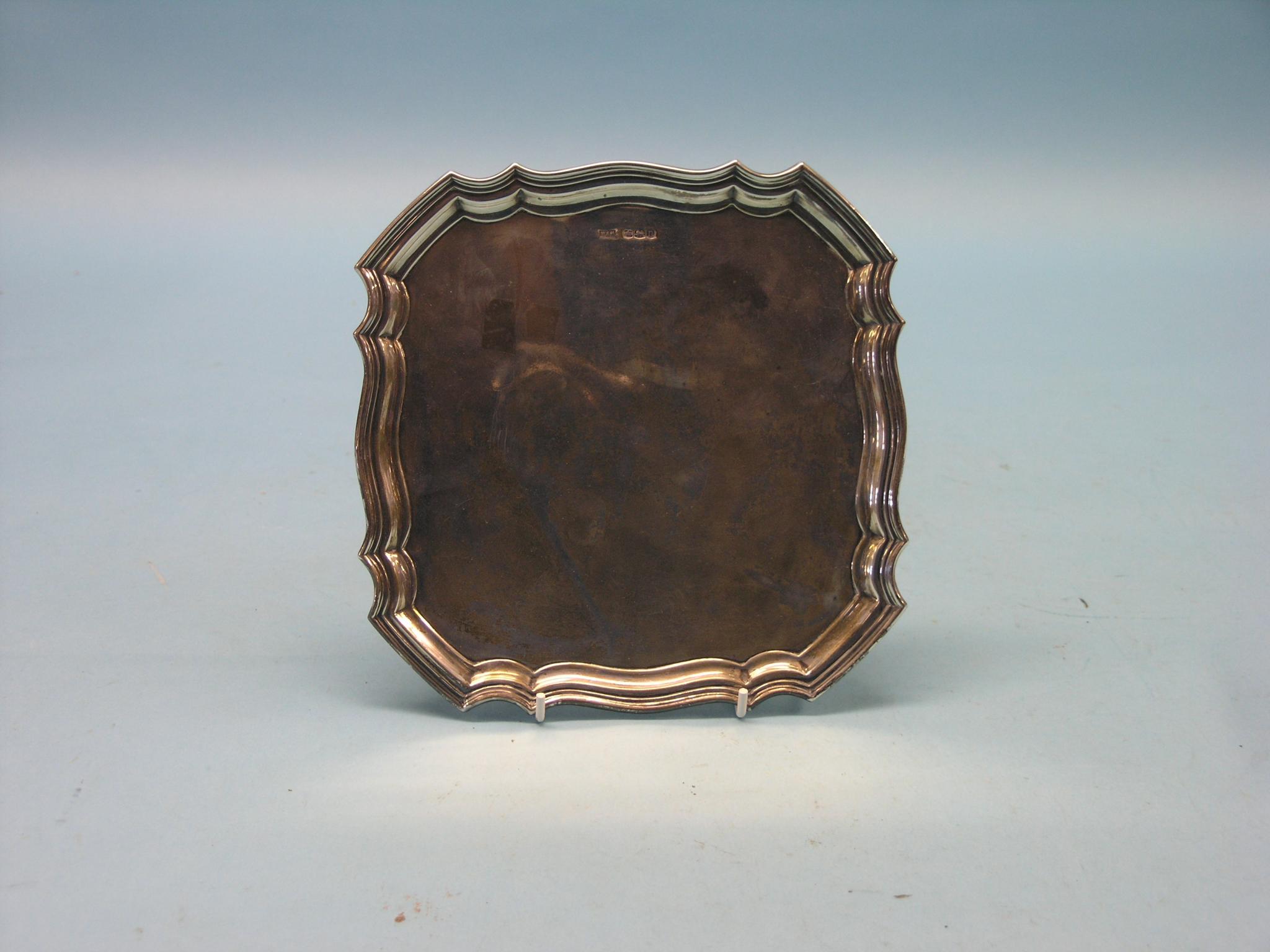 Appraisal: A Walker Hall silver salver square with pie-crust border four