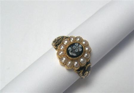 Appraisal: An early th century memorial ring with central floral carved