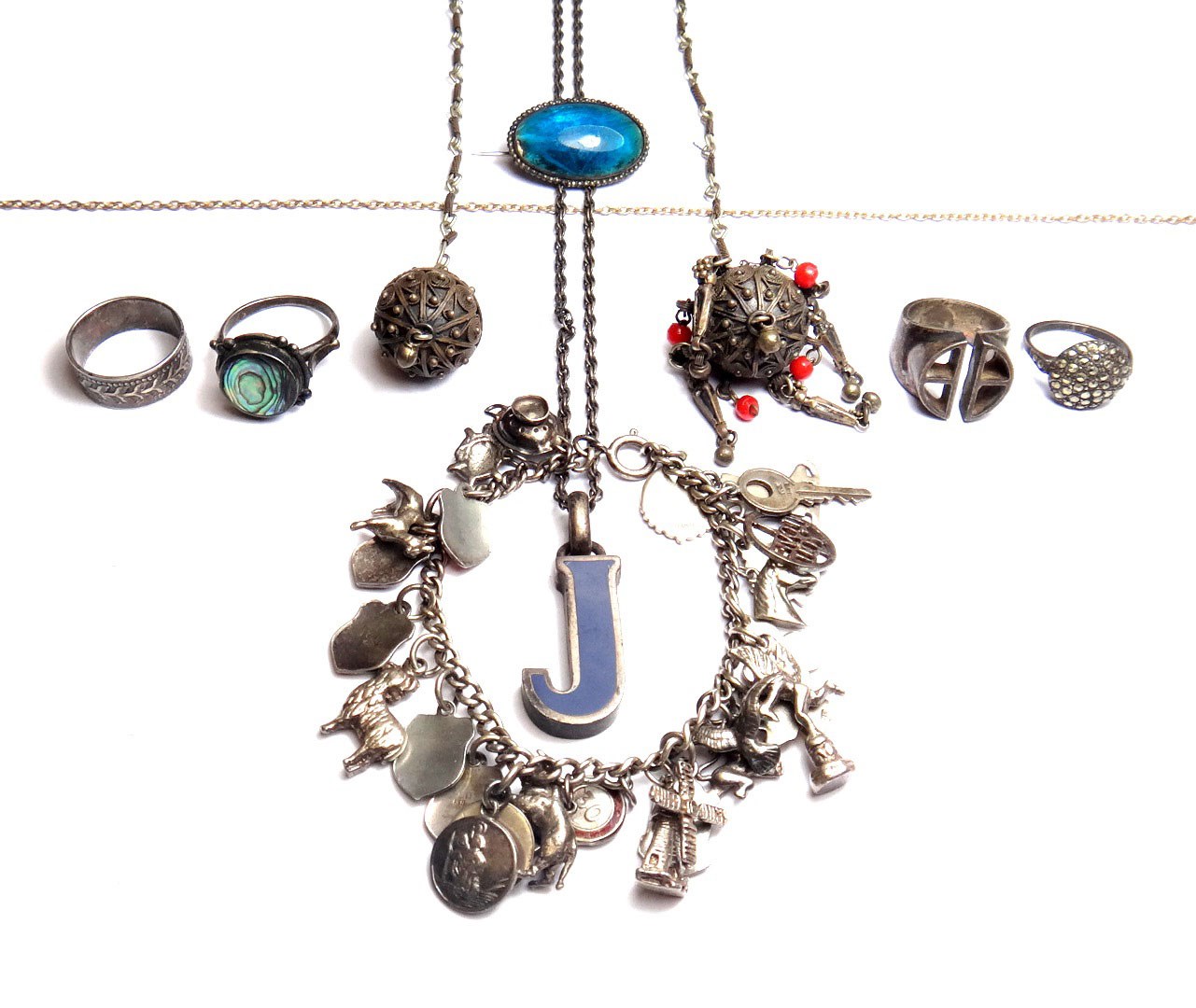 Appraisal: Mostly silver jewellery comprising a charm bracelet including enameled charms