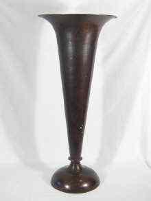 Appraisal: A floor standing brass trumpet vase stick stand with patinated