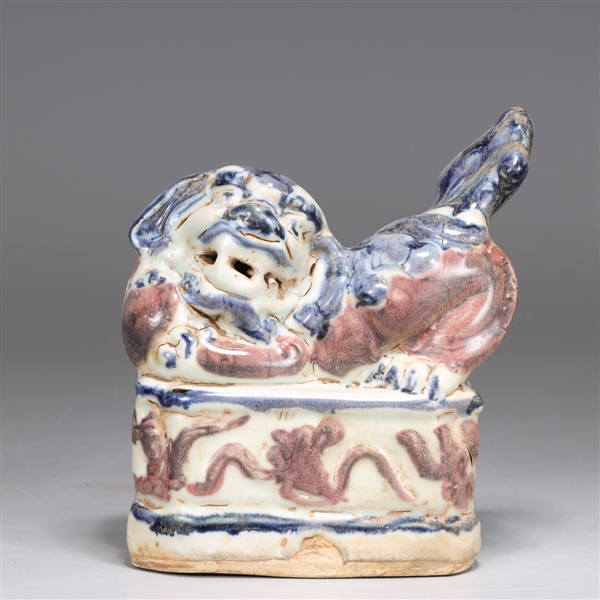 Appraisal: Chinese blue red and white model of foo lion atop