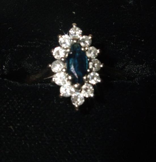 Appraisal: Sapphire and diamond cluster ring on white metal shank