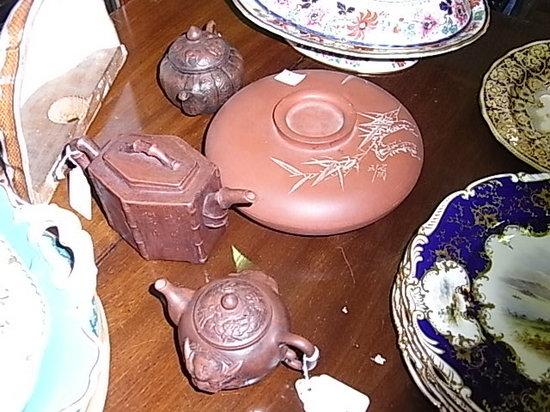 Appraisal: Three redware teapots and a bowl