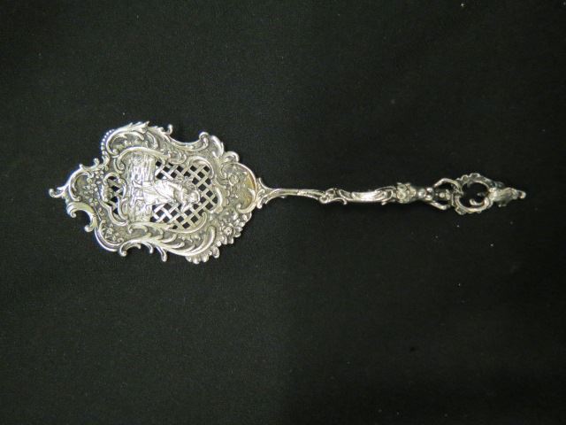 Appraisal: European Silver Ornate Pea Serving Spoon figural handle maiden in