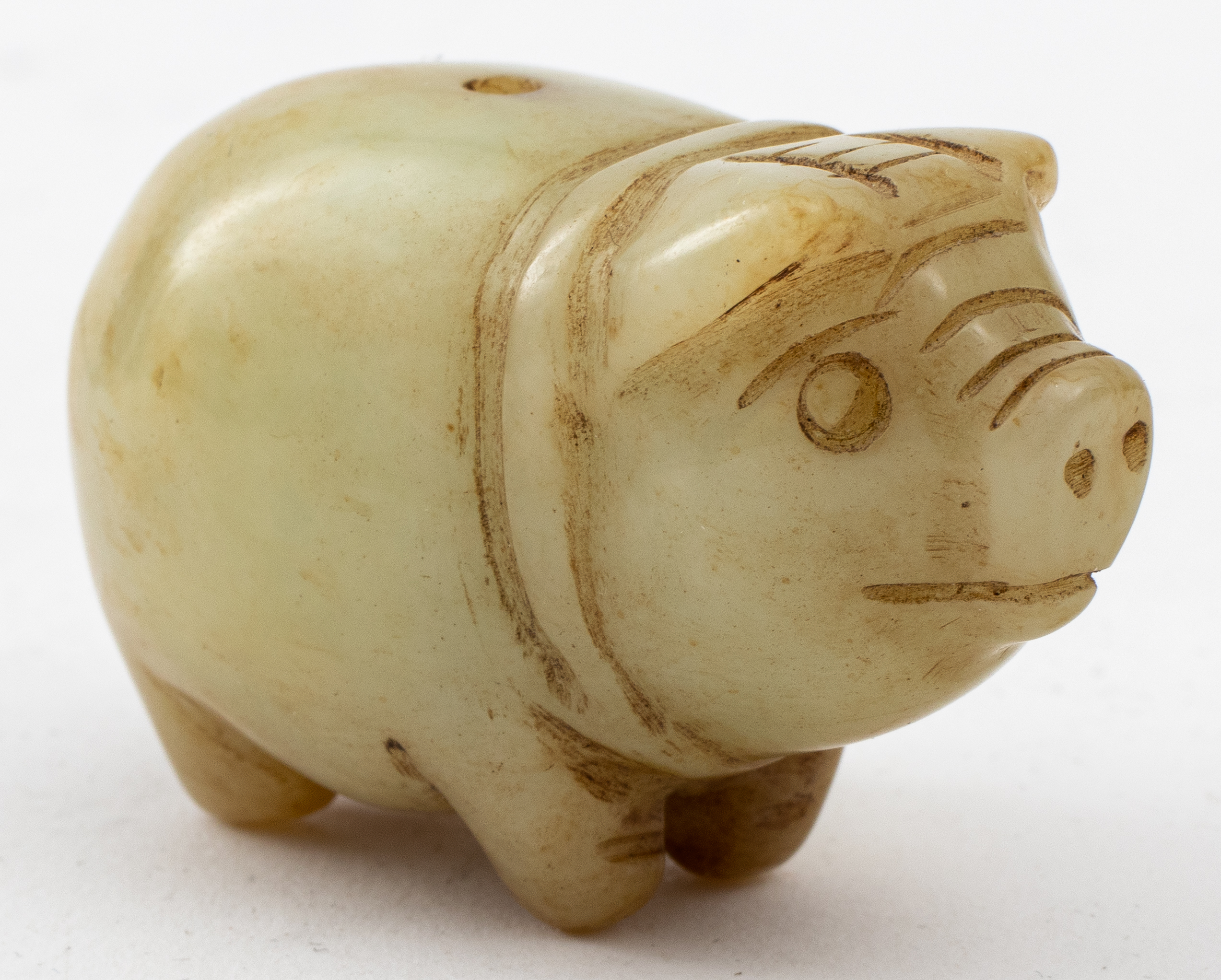 Appraisal: JAPANESE CARVED GREEN STONE PIG NETSUKE Antique Japanese carved green