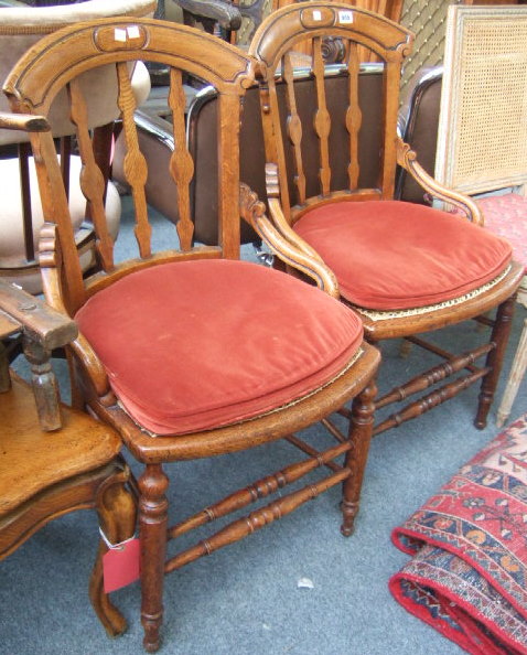 Appraisal: A pair of late Victorian oak and ash chairs with