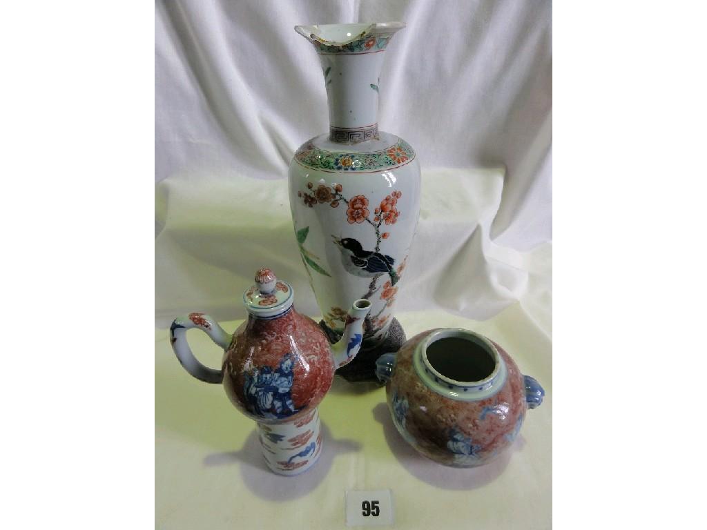 Appraisal: A th century oriental vase with painted Famille Rose flowering