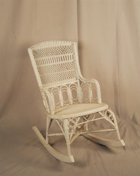 Appraisal: An Early and Diminutive Closed Arm Wicker Rocker painted white