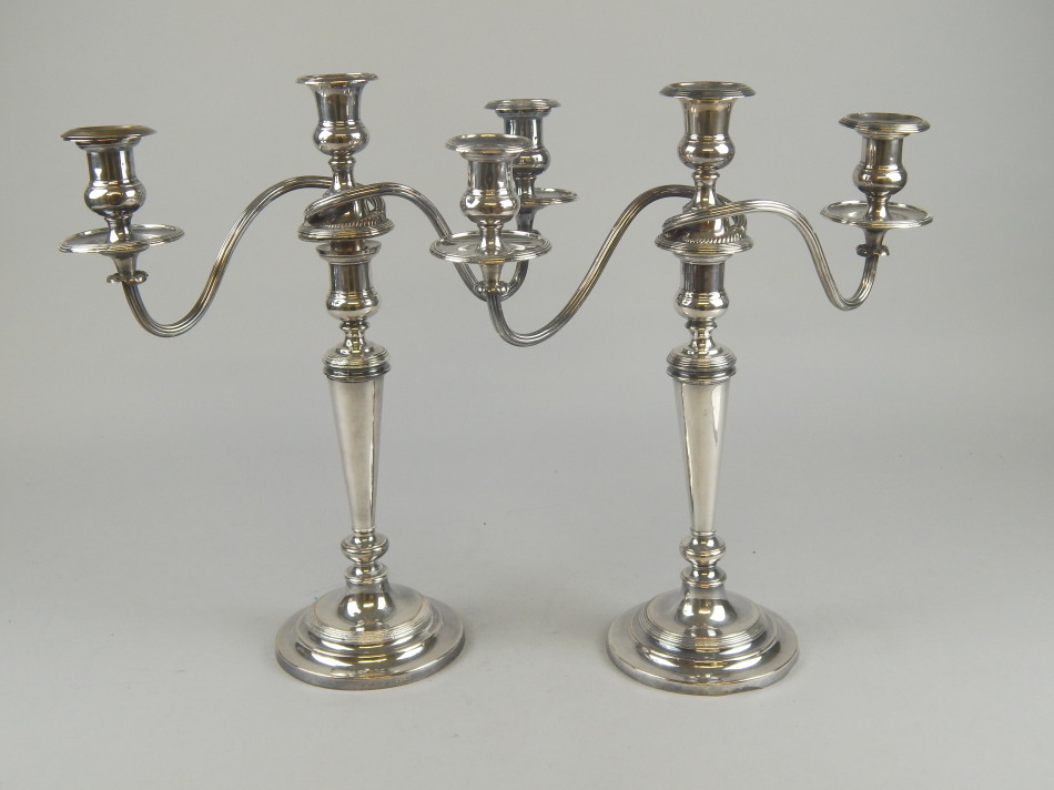 Appraisal: A pair of early thC silver plated three light candelabra