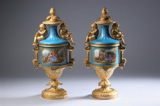 Appraisal: PAIR S VRES-STYLE ORMOLU-MOUNTED PORCELAIN URNS AND COVERS th century