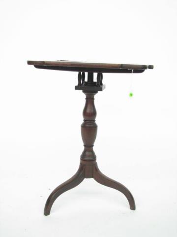 Appraisal: A vintage mahogany birdcage tilt top table with tripod pedestal