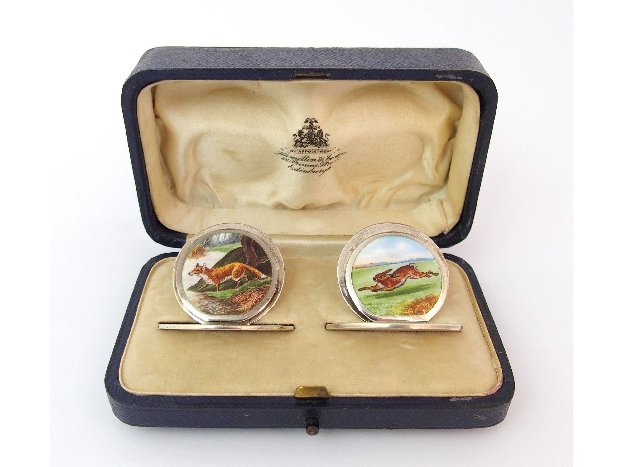 Appraisal: A cased pair of silver and enamel menu holdersby Sampson