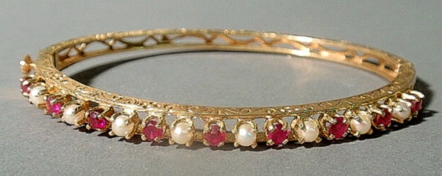 Appraisal: Ruby and pearl bangle bracelet set in k yellow gold