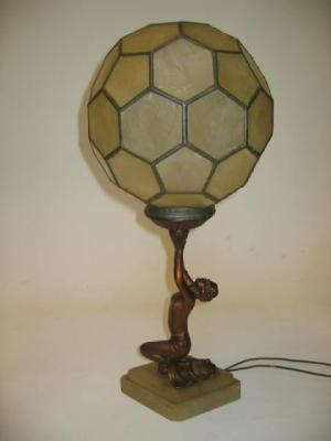 Appraisal: AN ART DECO SPELTER TABLE LAMP modelled as a kneeling