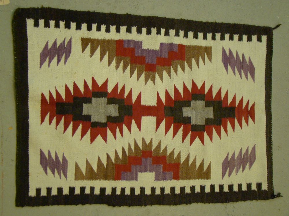 Appraisal: NAVAJO GANADO-STYLE RUG ' x ' With double medallion design