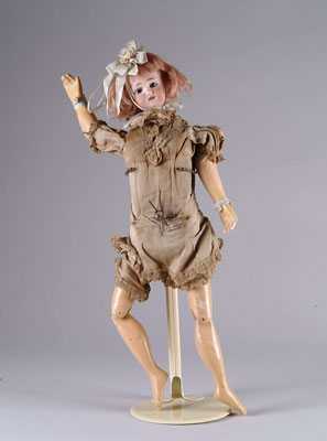 Appraisal: FRENCH SWIMMING DOLL Clockwork mechanism when wound doll proceeds to