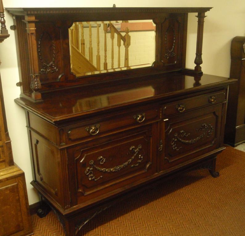 Appraisal: An Edwardian mahogany sideboard with mirrored and panelled back two