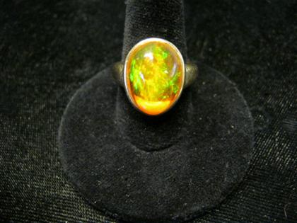 Appraisal: karat yellow gold and Mexican opal ringOval shaped fire opal