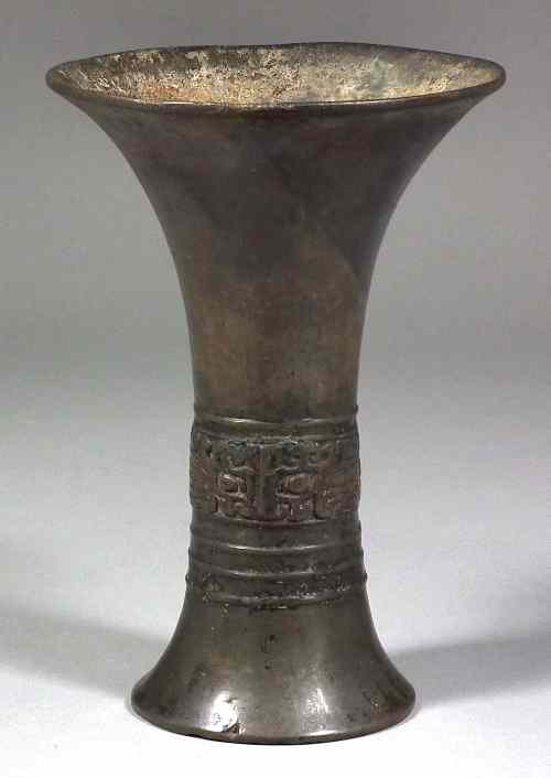 Appraisal: A Chinese bronze Gu wine vessel the body cast with