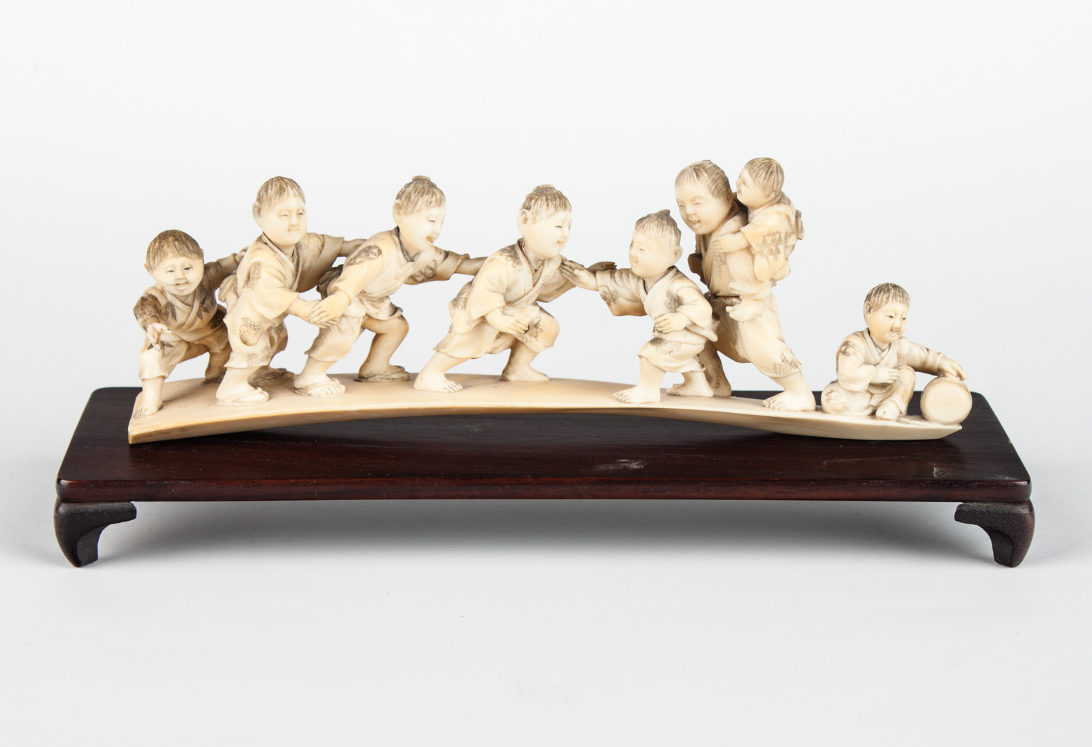 Appraisal: Japanese carved ivory figural group eight playful children on ivory