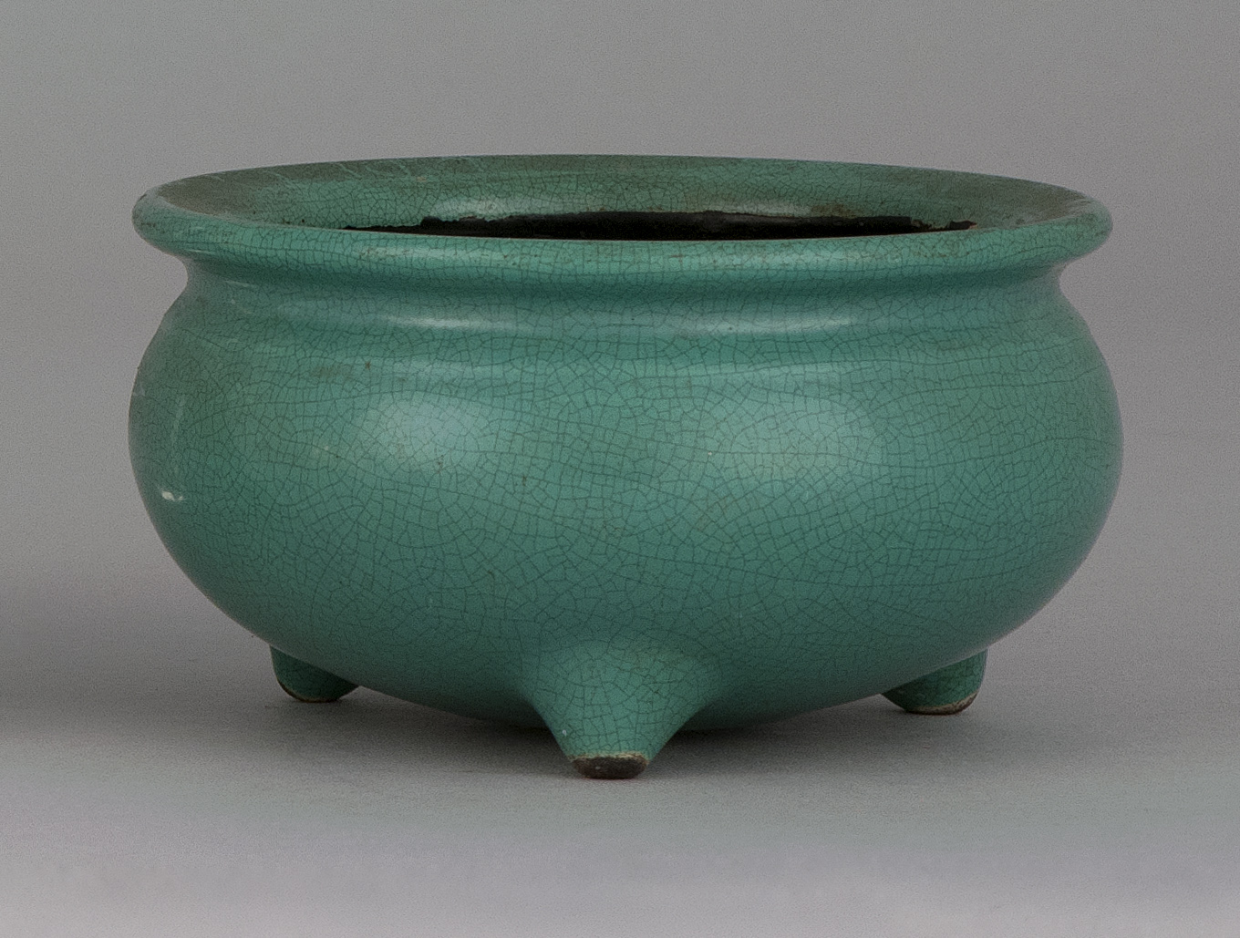 Appraisal: APPLE-GREEN PORCELAIN CENSER th CenturyIn kettle form with tripod base