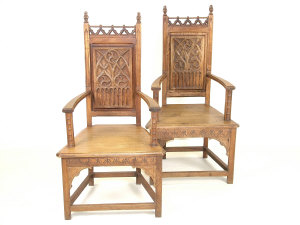 Appraisal: A pair of oak Gothic Revival open armchairs each with