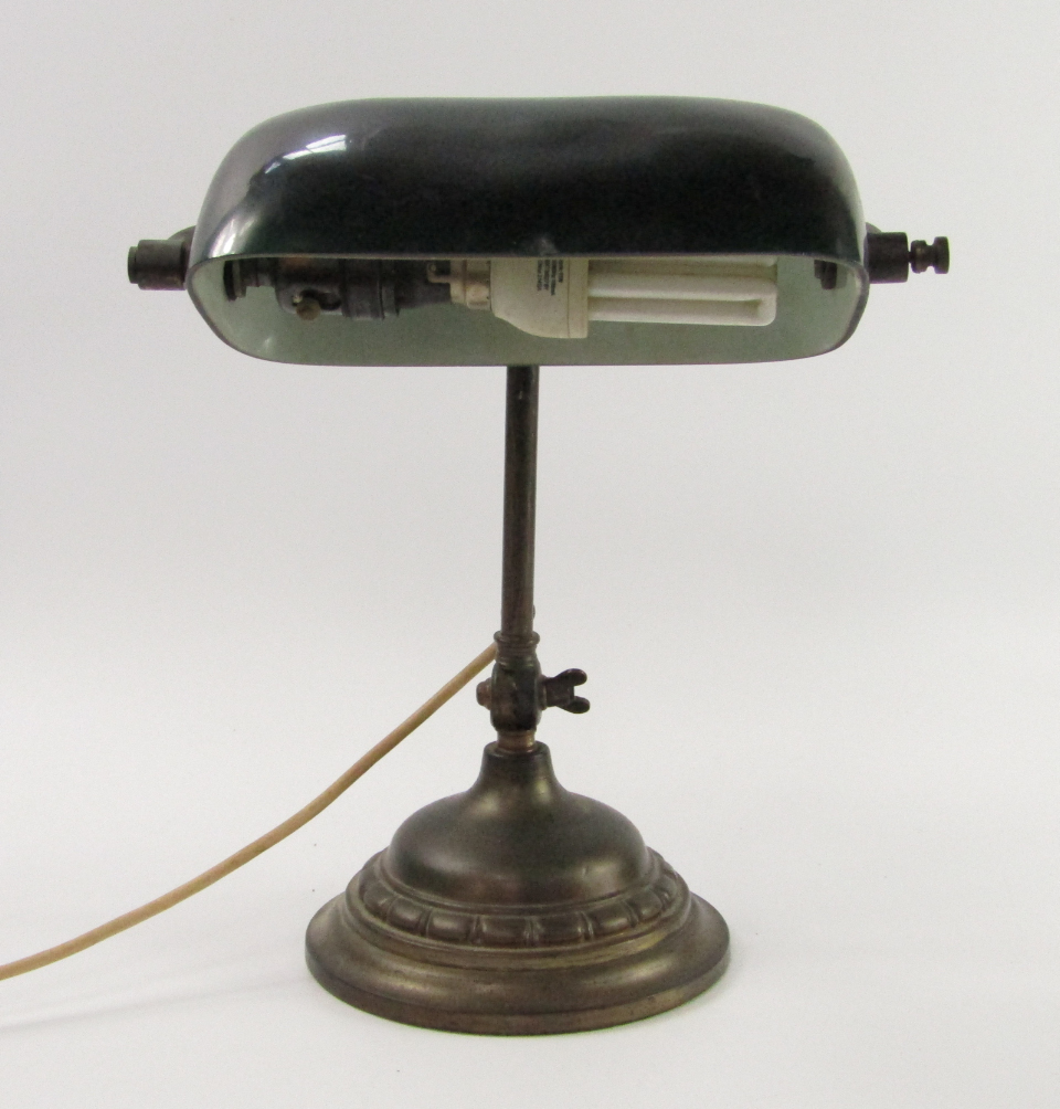 Appraisal: A brass and cast iron angle poise table lamp with