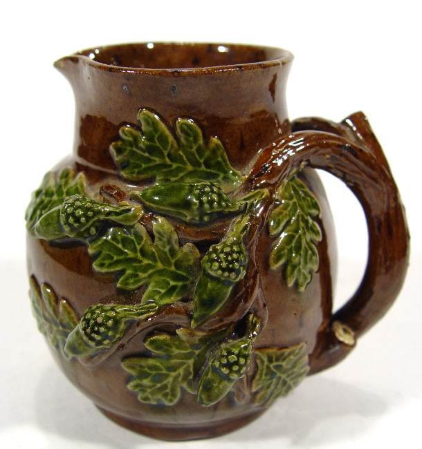 Appraisal: Rye pottery style naturalistic jug with branch handle and acorn