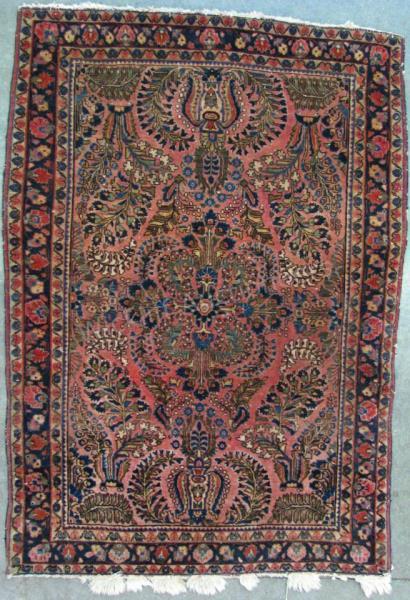 Appraisal: A handmade antique Oriental area rug ca Sarouk design red