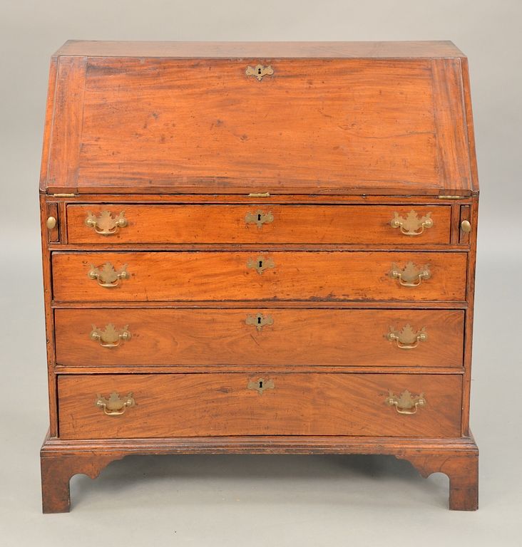 Appraisal: Chippendale mahogany desk with slant lid over four drawers on