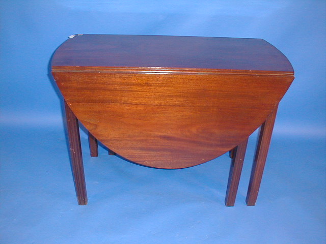 Appraisal: A Georgian style mahogany gate leg table with moulded legs