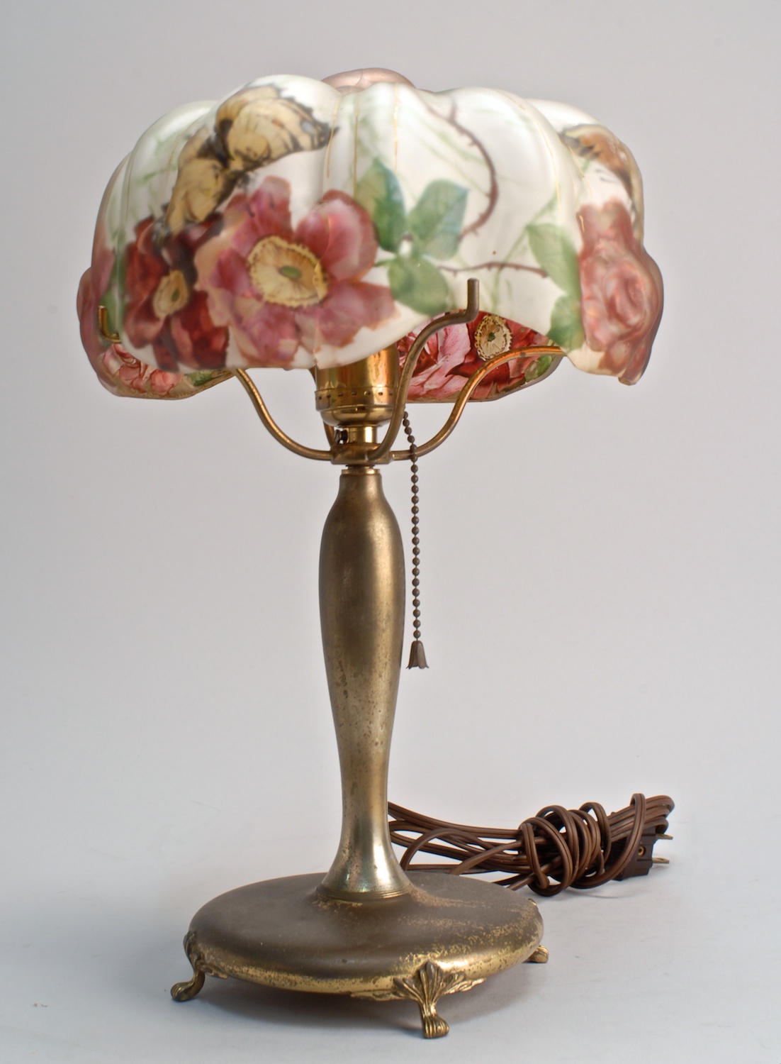 Appraisal: TH CENTURY PAIRPOINT TABLE LAMP with flower and butterfly-decorated puffy