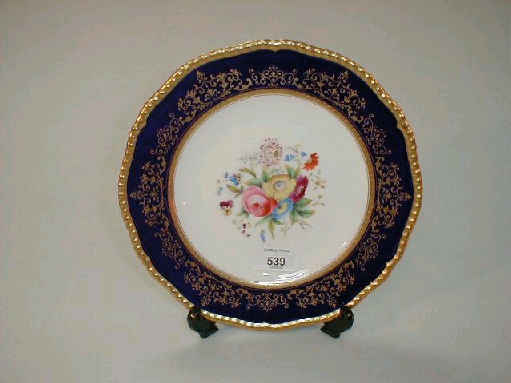 Appraisal: A Coalport porcelain plate hand painted with central floral reserve