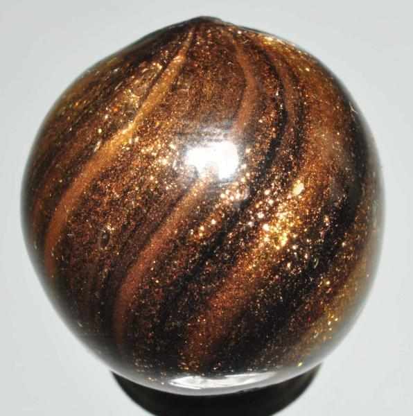 Appraisal: Black Glass Lutz Marble Description Loaded with lutz One thin