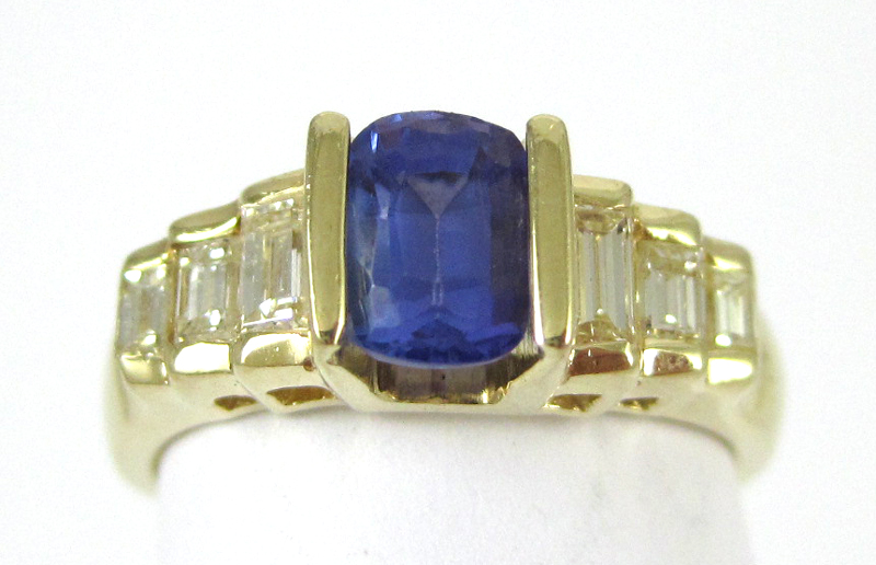 Appraisal: TANZANITE DIAMOND AND FOURTEEN KARAT GOLD RING with three graduated