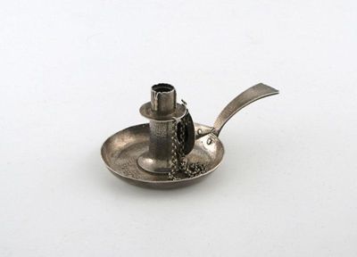 Appraisal: A miniature silver Arts and Crafts chamber stick of circular