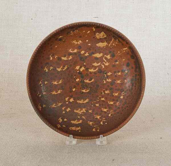 Appraisal: Pennsylvania redware pie plate th c with brown and yellow