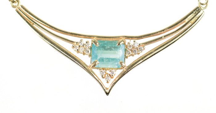 Appraisal: EMERALD DIAMOND AND FOURTEEN KARAT GOLD PENDANT NECKLACE The V-shaped