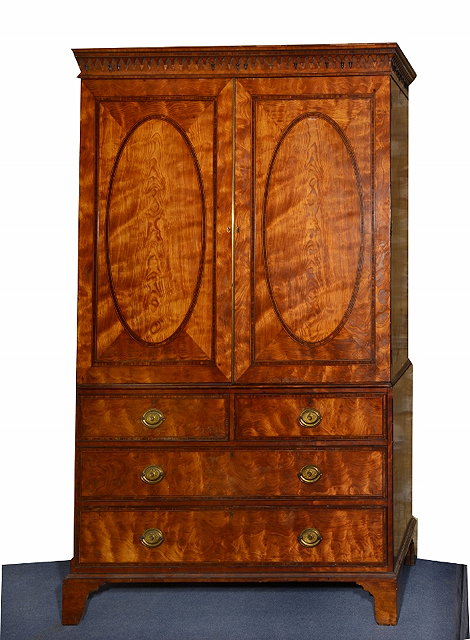 Appraisal: A GEORGE III SATINWOOD LINEN PRESS the moulded cornice with