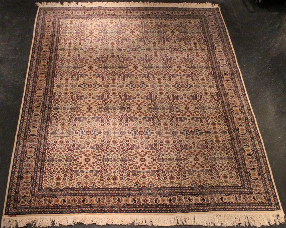 Appraisal: LARGE INDO-PERSIAN WOOL RUG repeating allover floral design on an