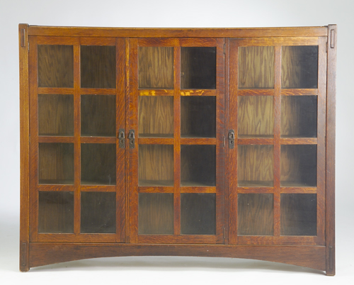 Appraisal: LIFETIME Three-door bookcase with eight panes per door adjustable shelves