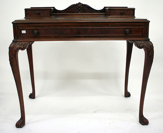 Appraisal: A MODERN HARDWOOD LADIES DRESSING TABLE the superstructure with carved