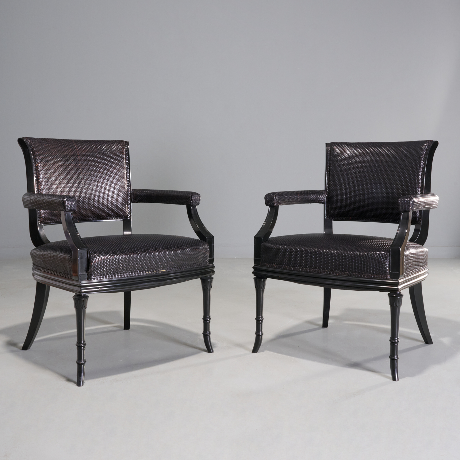 Appraisal: PAIR WOVEN LEATHER ARMCHAIRS PETER MARINO th c USA dark