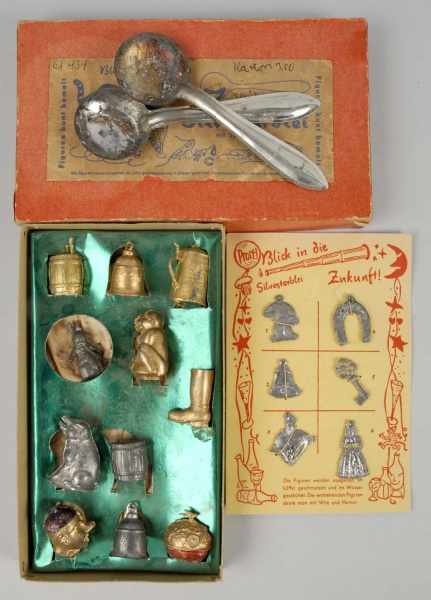 Appraisal: Lot of German Metal Charms Description Includes two tin spoons