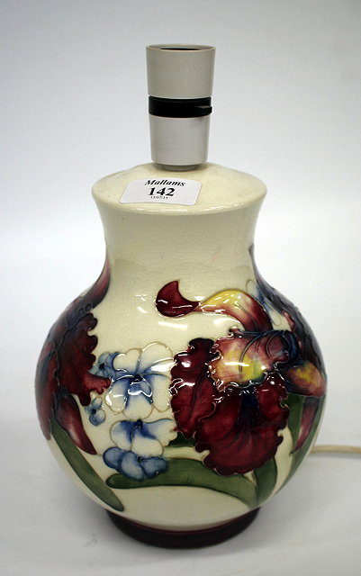 Appraisal: A MOORCROFT TABLE LAMP the cream ground decorated with various