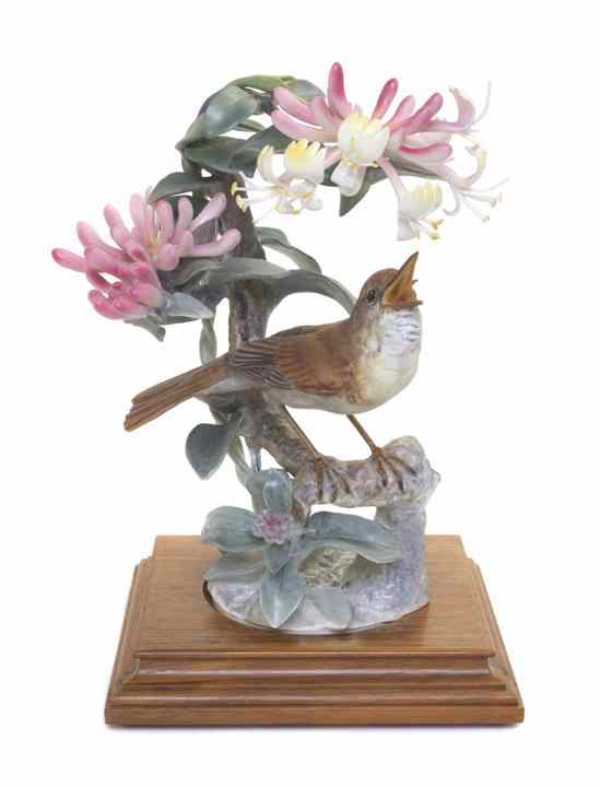 Appraisal: A Royal Worcester Dorothy Doughty Bird Nightingale perched on honeysuckle