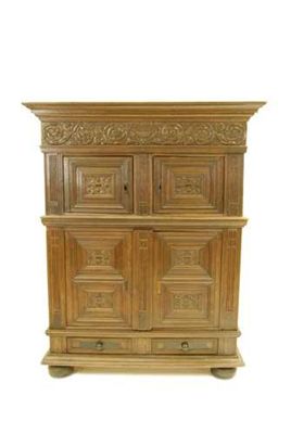 Appraisal: A Flemish oak cupboard with ebony inlay the detachable cornice